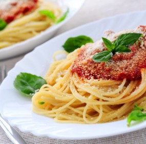 Pasta with tomato sauce basil and grated parmesan